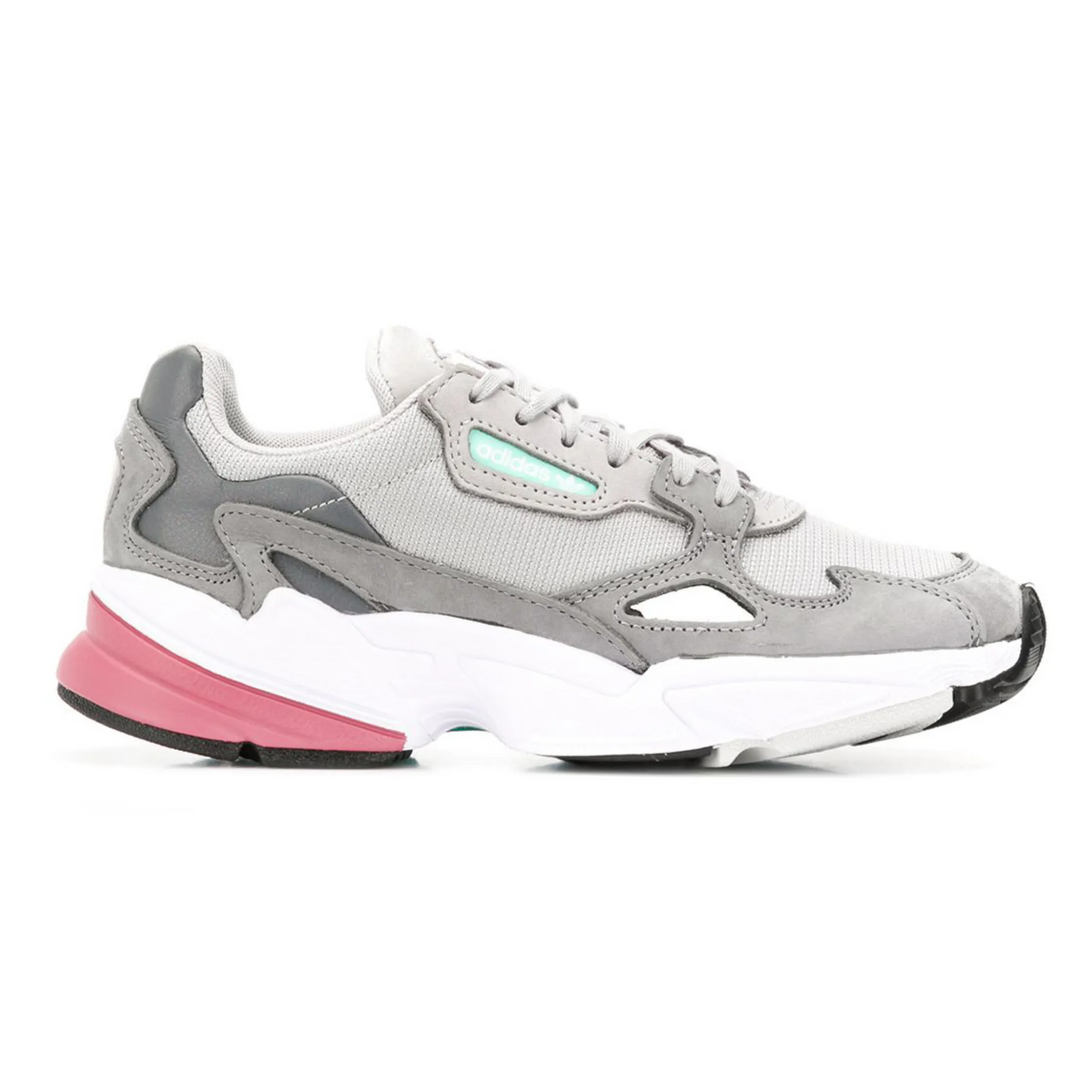 Adidas FALCON GREY Women side view of grey sports shoes with rubber sole and padded ankle design.