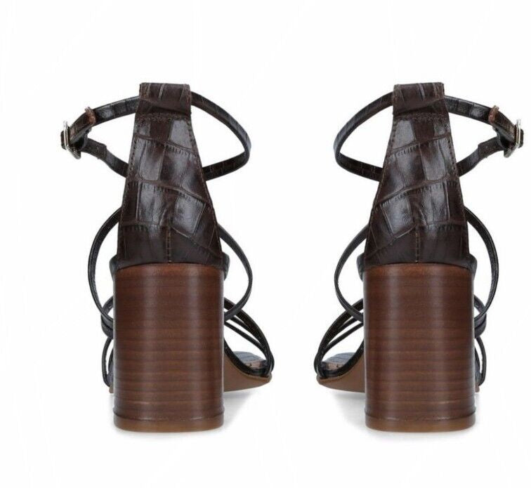Back view of Carvela Croc Print Leather Keel sandals, dark brown natural leather, 7 cm heel, ankle strap closure.