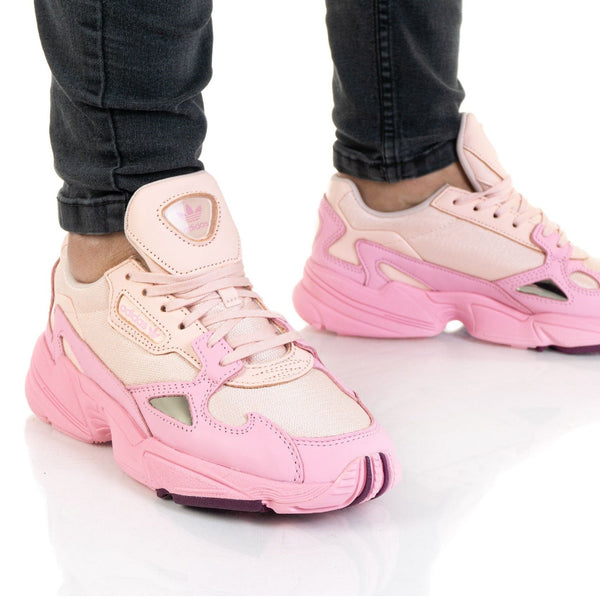 Close-up of adidas FALCON Women EF1994 sneakers in pink, showcasing stylish design and comfort.
